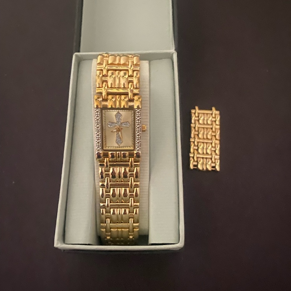 Elegant Gold Women's Watch with Cross Detail